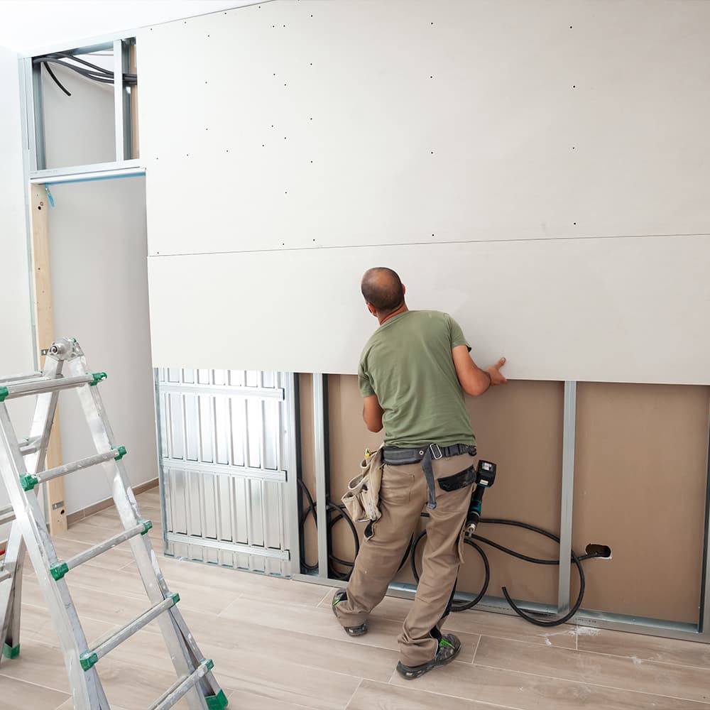 Pose de plaques de plâtre pour rénovation et maison en suisse